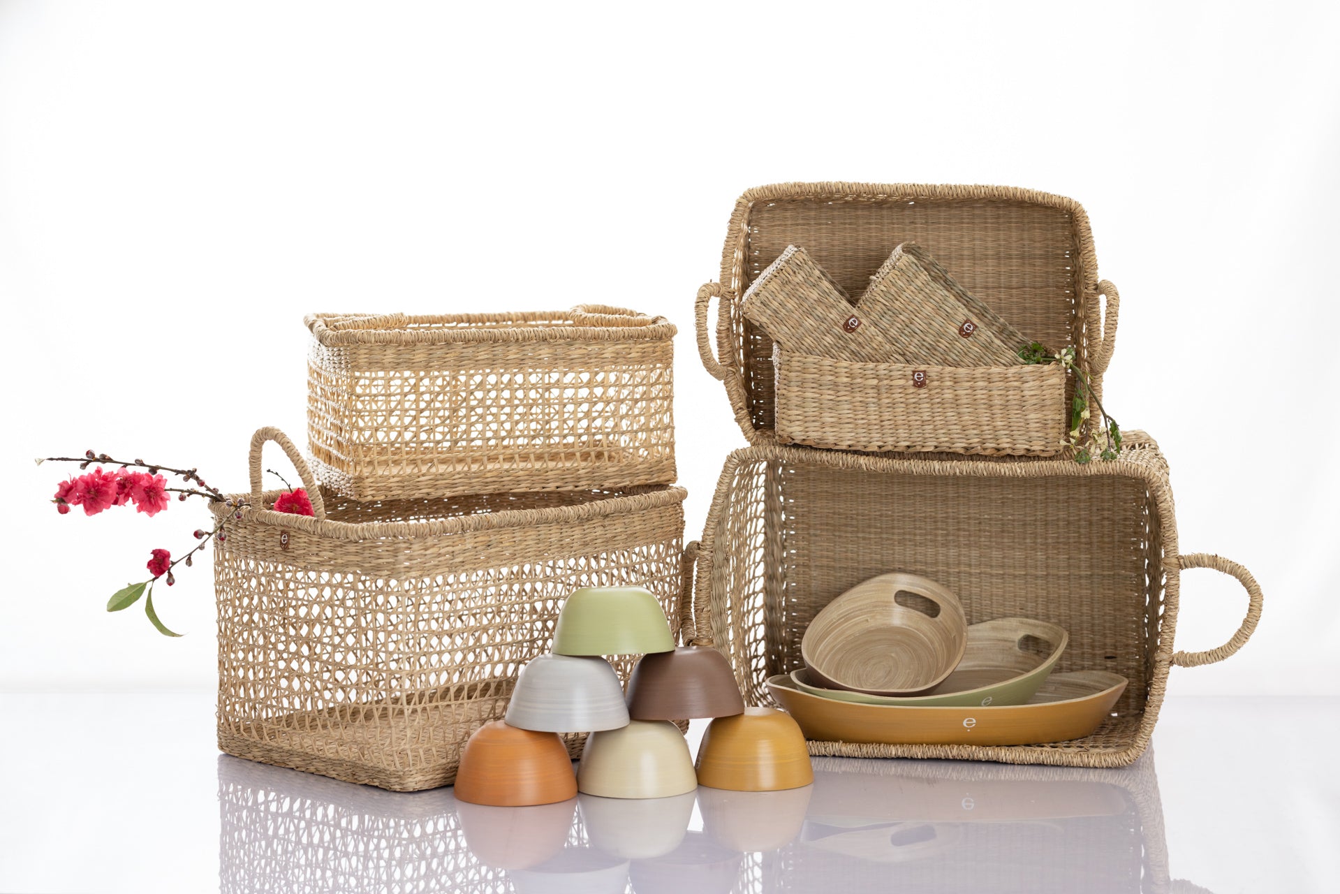 Assortment of natural seagrass baskets and spun bamboo trays  idea for IKEA Kallax shelf