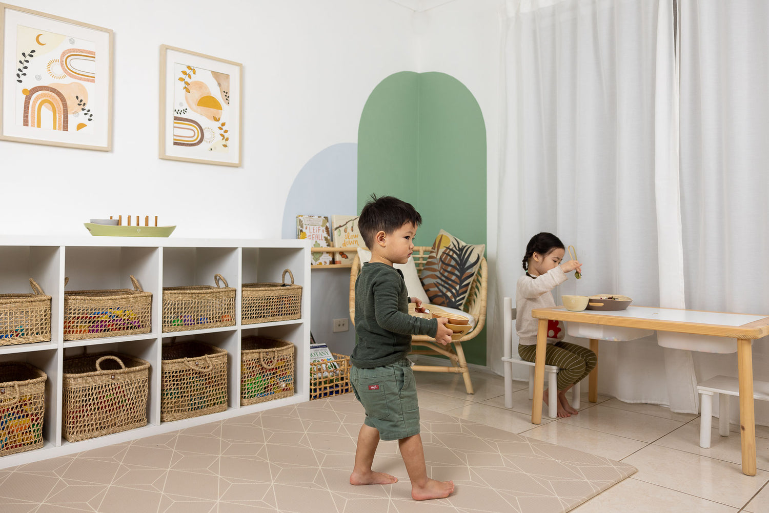 Children playing with toys in a tidy Montessori play space