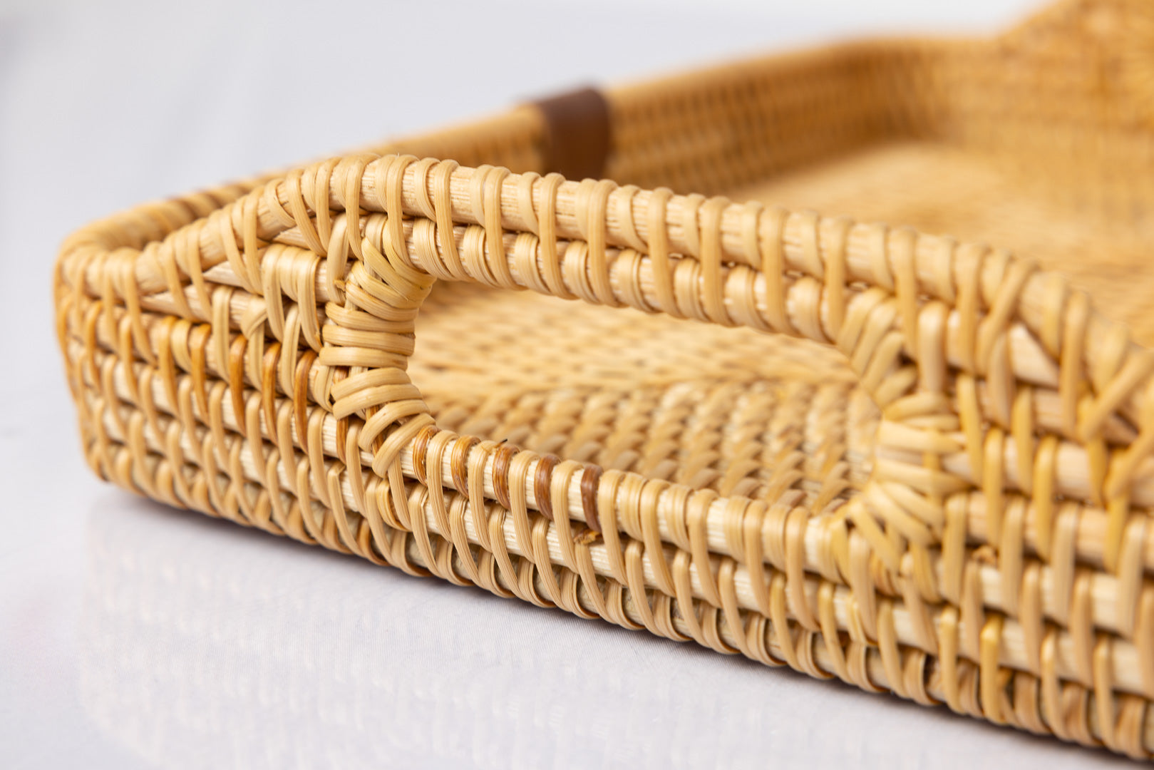 Montessori rattan tray close up of handle