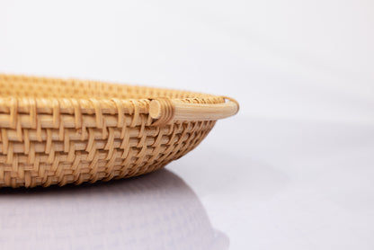 Close up of rattan handle on large round montessori bowl