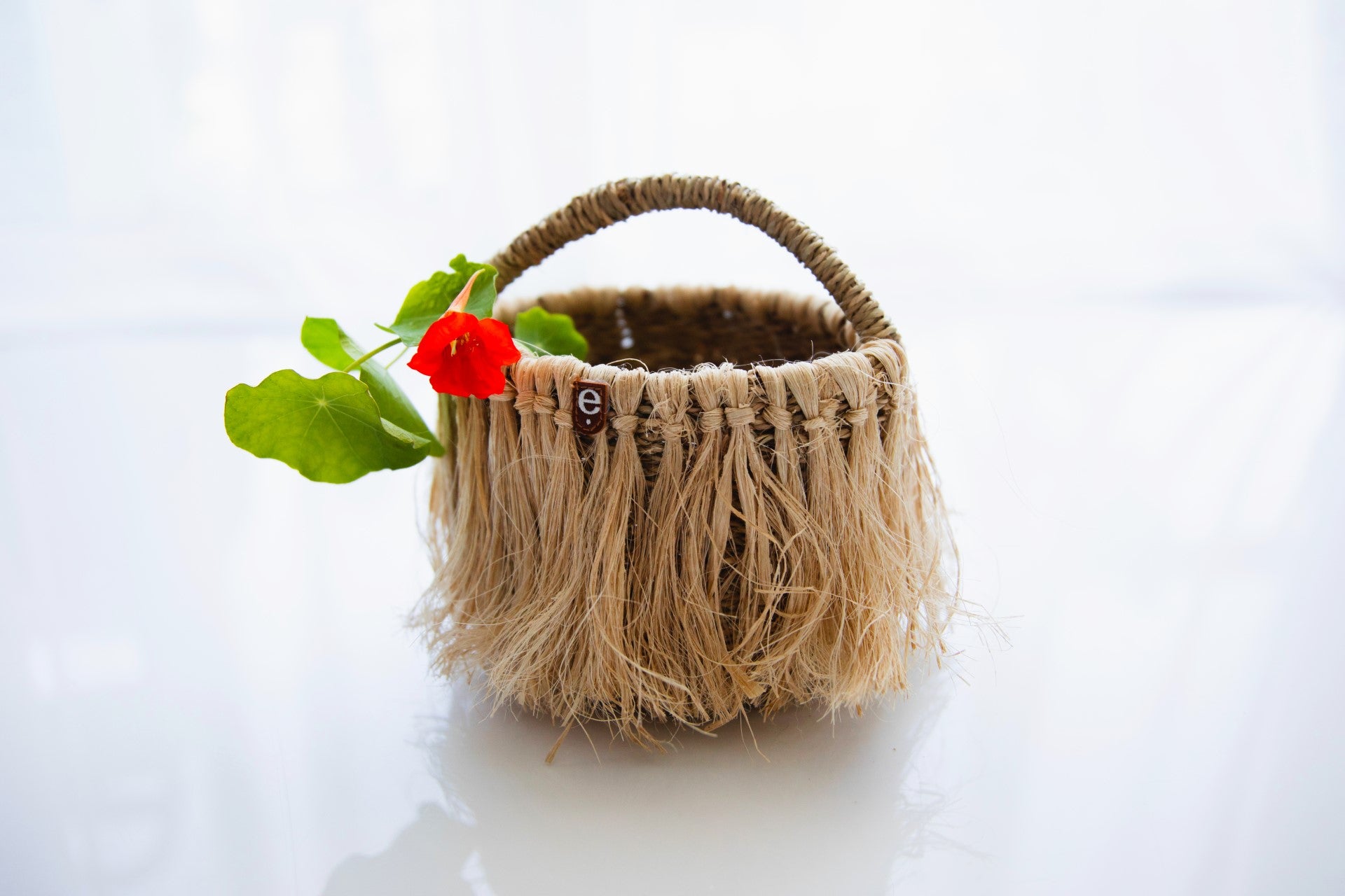 Child sized beach basket styled with flower