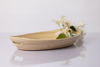 Montessori natural tray on an angle to show handle