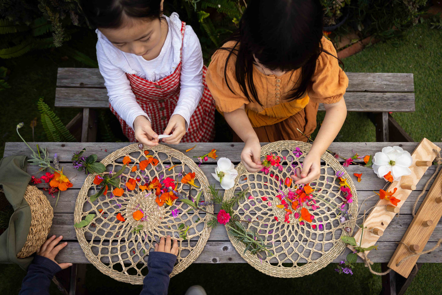 Children engaging in nature play with seagrass natural weaving looms