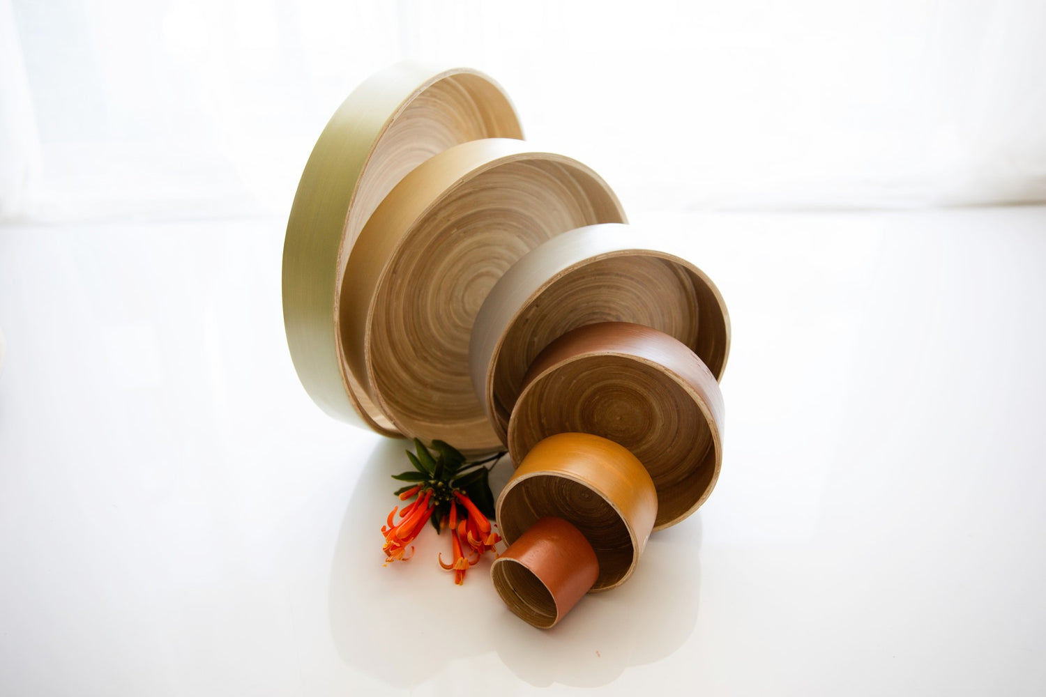 6 set circular spun bamboo tray set in upright display