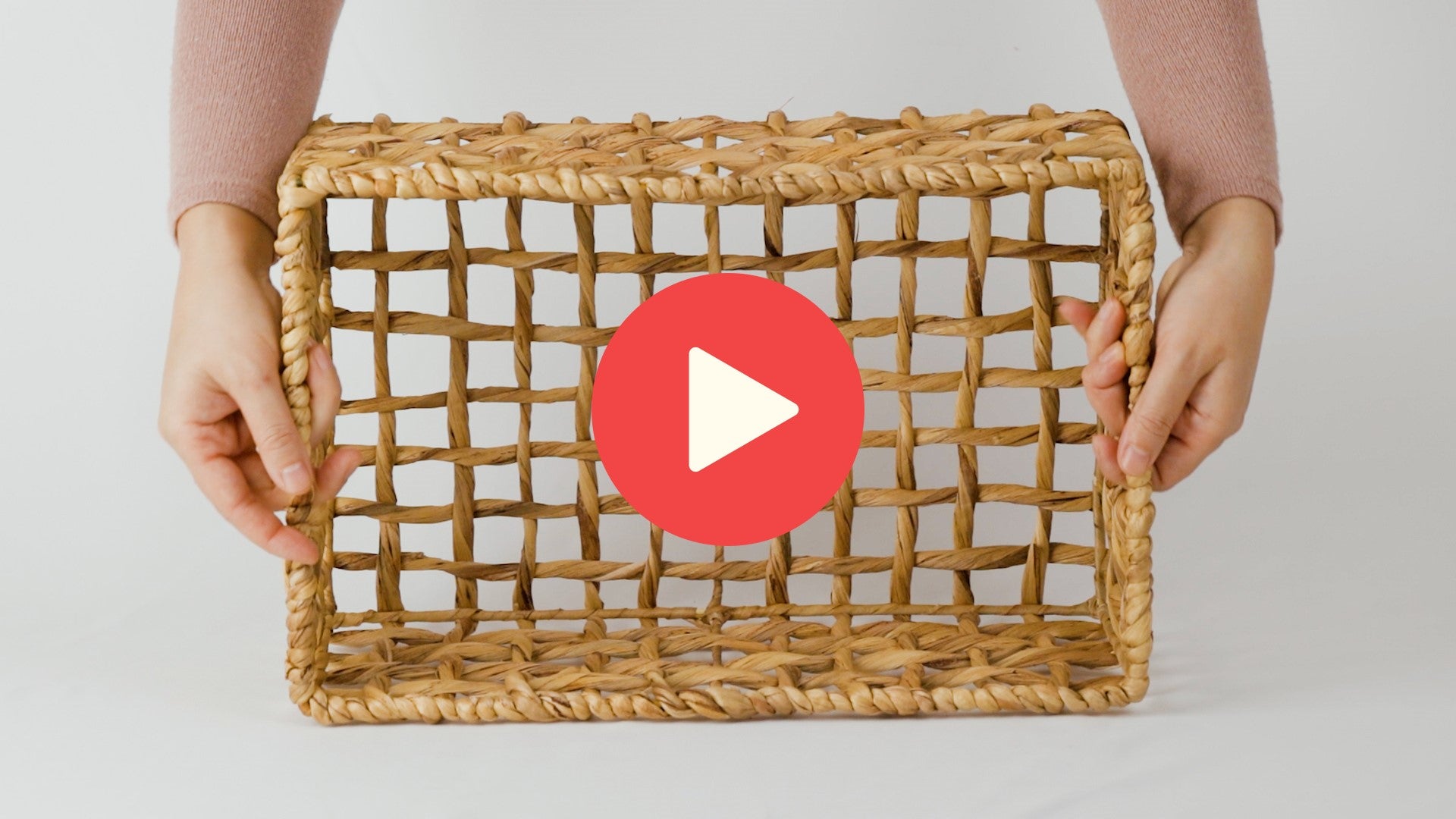 Video of hands demonstrating size of medium water hyacinth basket